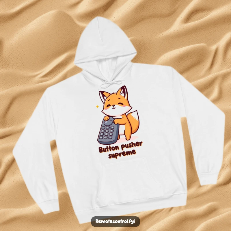 Funny Kawaii Fox Hoodie showing an energetic fox absorbed in pressing all the buttons on a large remote control.