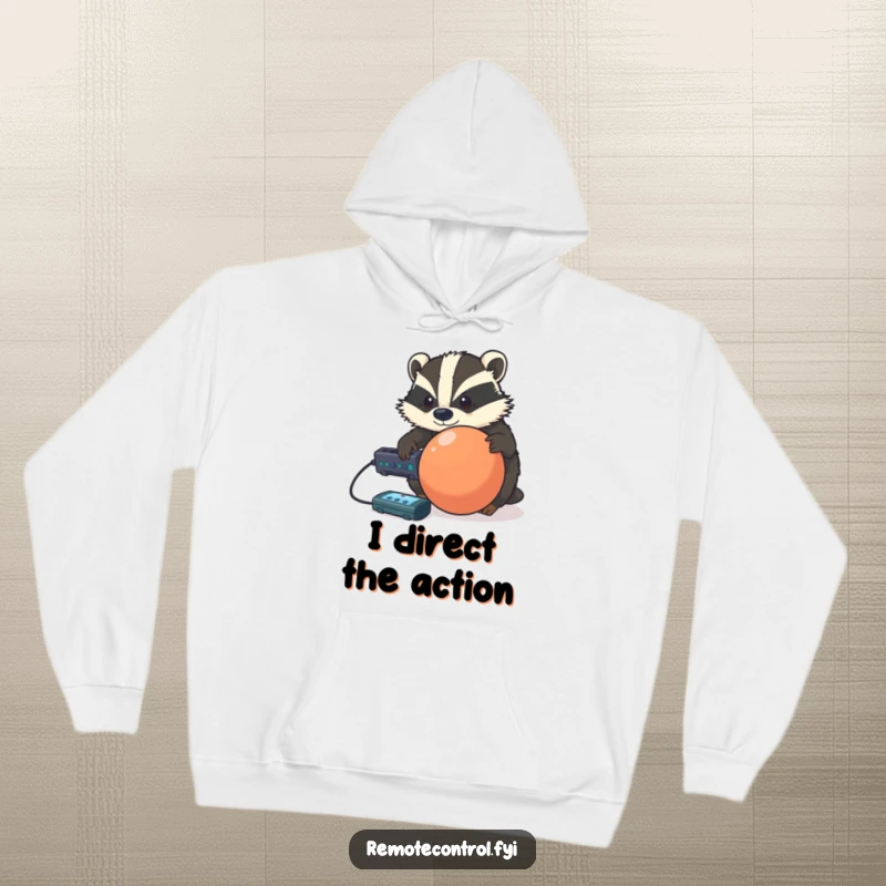 Funny determined badger controlling a rolling ball with a remote, printed on a soft and warm hoodie.