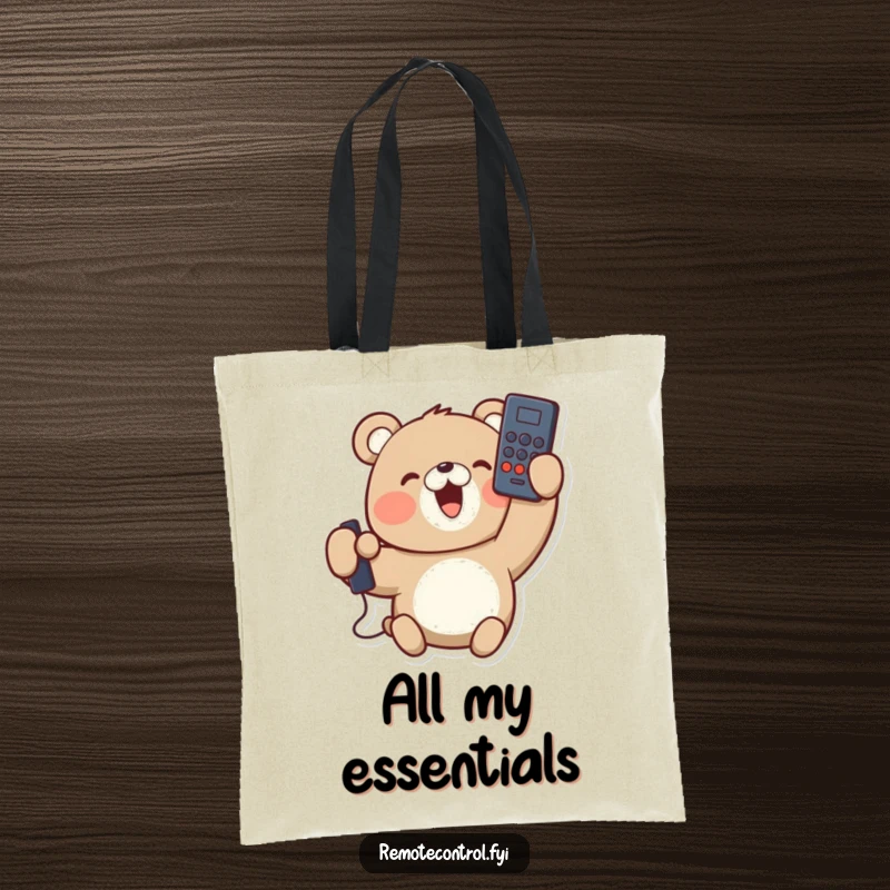 Funny tote bag with a delighted bear character holding a remote control upside down, smiling. Great for groceries and laughs.