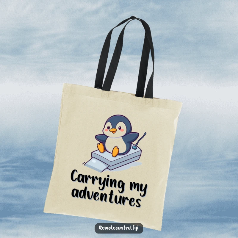 Funny penguin tote bag with a playful penguin sliding down a remote control like a ramp, a humorous and practical accessory.